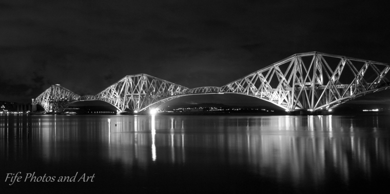 Forth Rail Bridge at night from South Queensferrry - monochrome