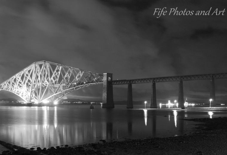 Forth Rail Bridge southern end, with Hawes Pier lit up on right hand side